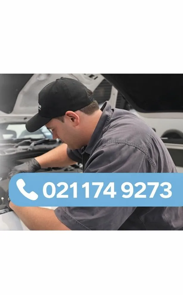 Rani working under the bonnet of a vehicle