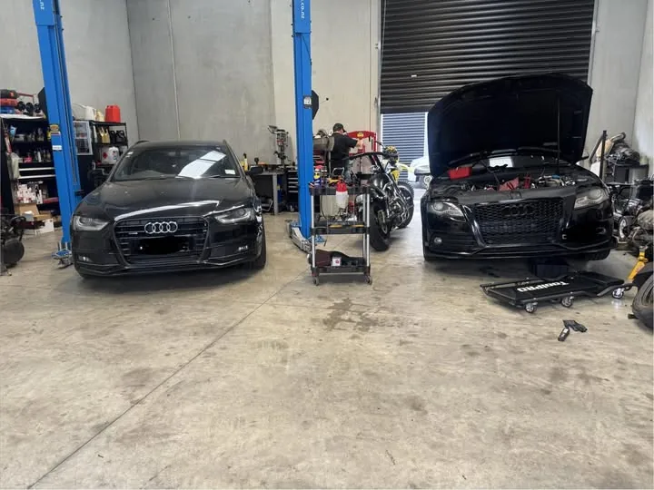 Vehicles up on the hoists in the Mobile Automotive Solutions workshop